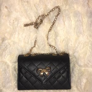 Quilted bow chain purse